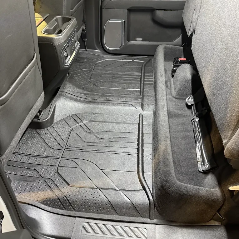 Cleaned black rear floor mats with the seat folded up