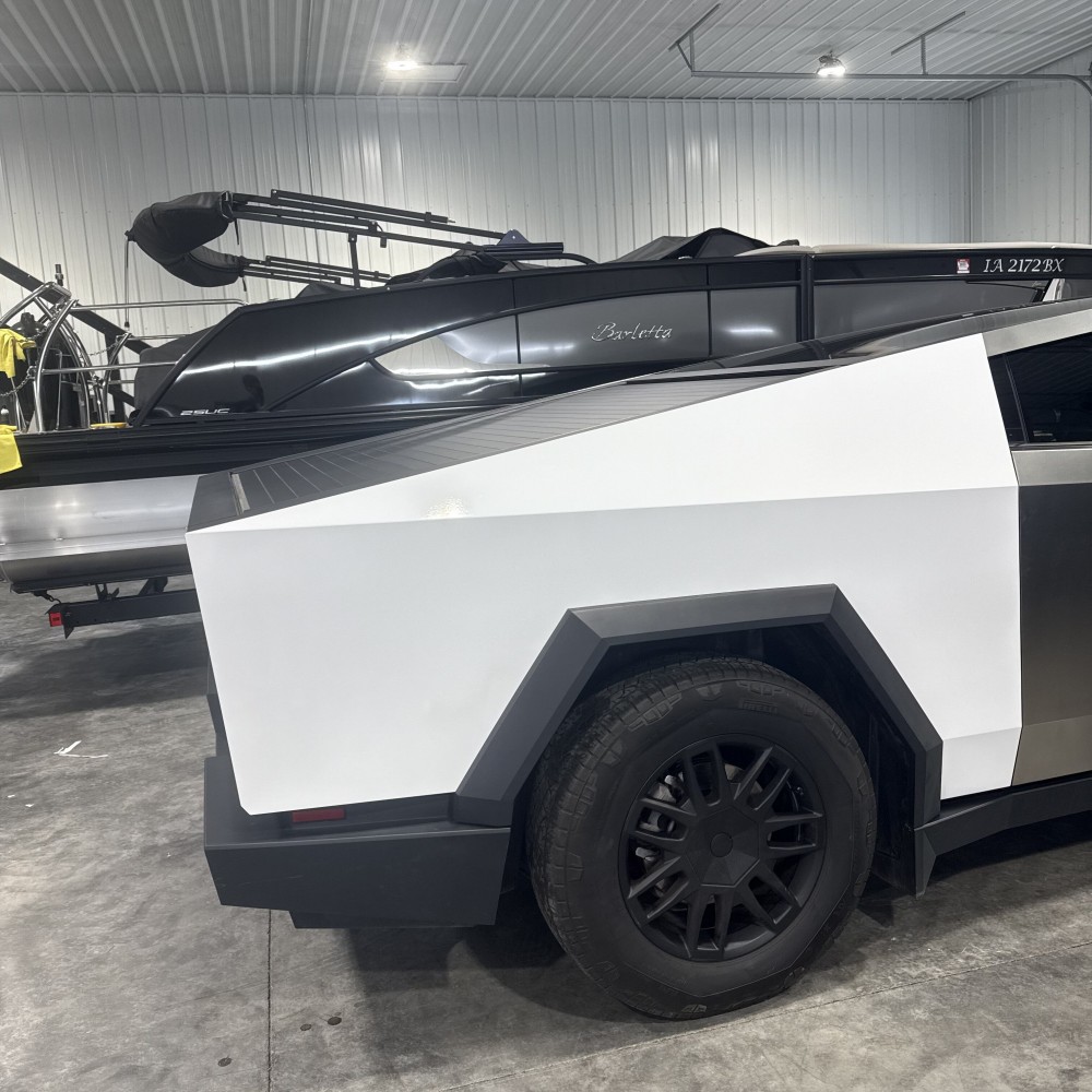 Rear quarter panel wrapped in white vinyl